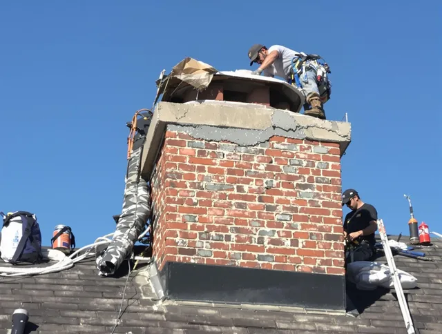 Bedford Chimney Sweep installing a custom chimney crown in Bedford, OH