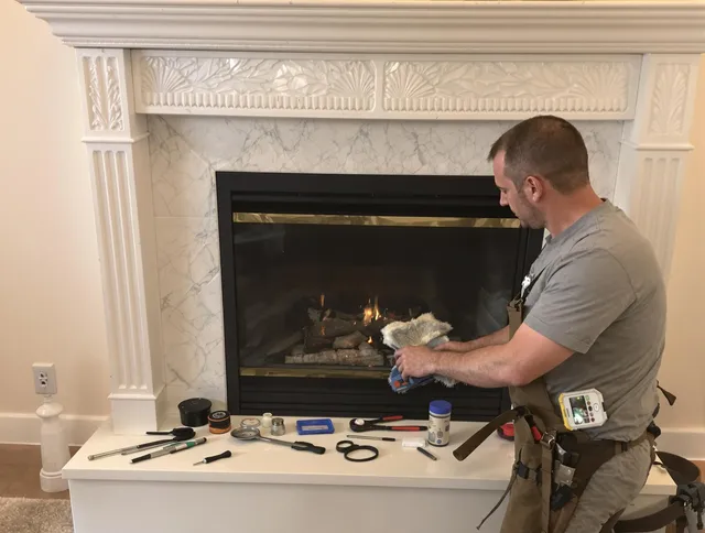 Bedford Chimney Sweep performing fireplace maintenance in Bedford, OH