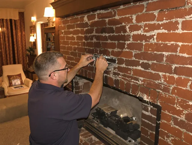 Bedford Chimney Sweep expert fixing a fireplace in Bedford, OH